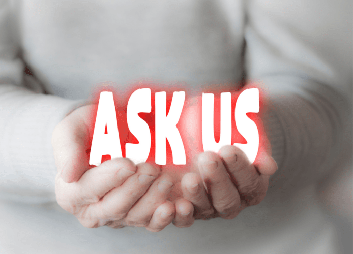 hands holding 'ask us' words