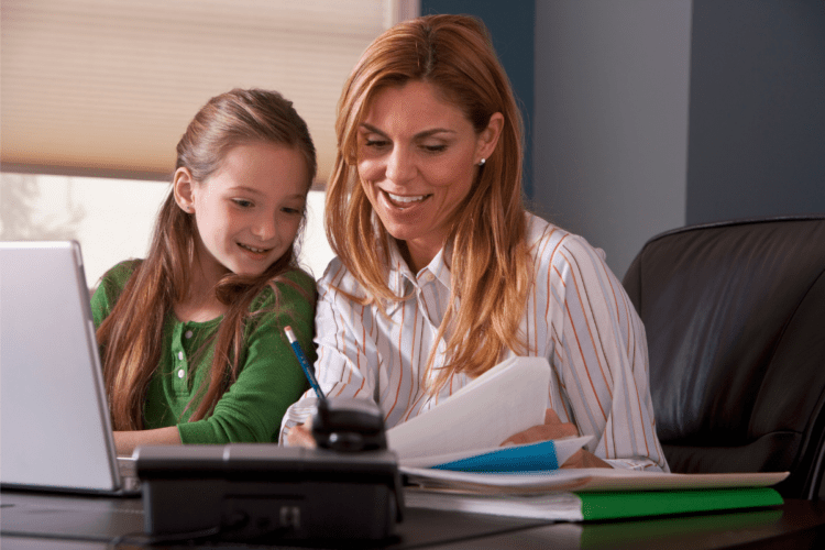 woman at work with child