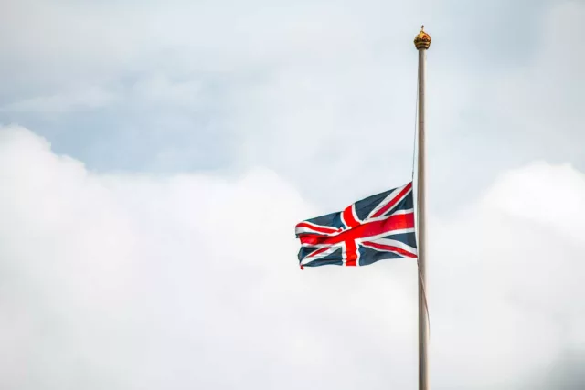 queens funeral flag at half mast on bank holiday